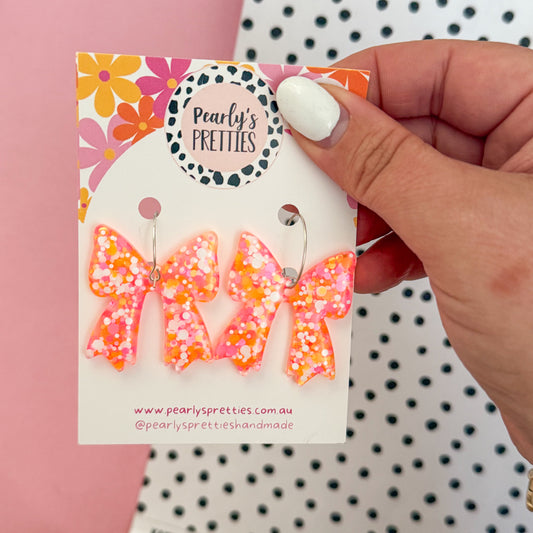Bonnie Bow dangle hoop earrings- Orange and pink sparkle